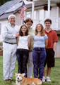 The Hathaways (left to right: Alden, Mary, Carol, Megan and Tripp — with Piper; aka Solar Dog at their feet) promote renewable energy by building a solar powered house.